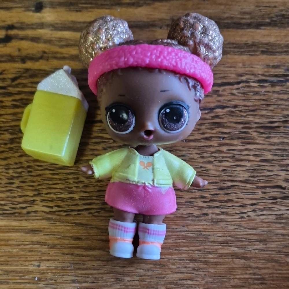 L.O.L. Surprise! Doll Pink Headband Yellow Jacket Pink Skirt Brown Skin